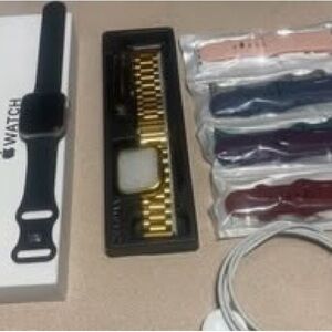 Apple Watch SE (Gen 2) 40mm w/ black band & charger & other accessories.